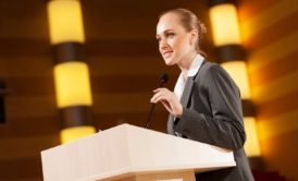 woman speaking in podium