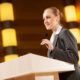 woman speaking in podium