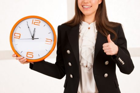 woman holding wall clock