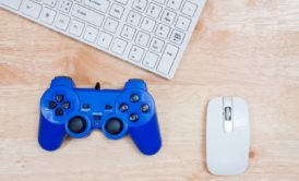 white keyboard mouse and blue game controller