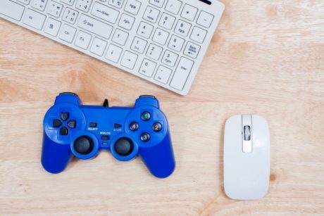 white keyboard mouse and blue game controller