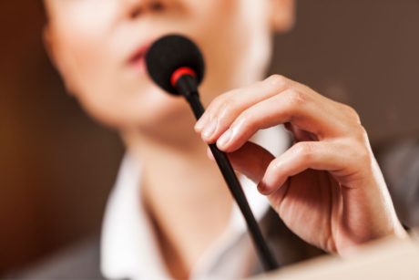 public speaker holding mic