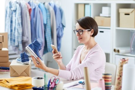 woman taking photo of product