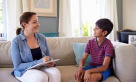 child psychiatrist talking to boy