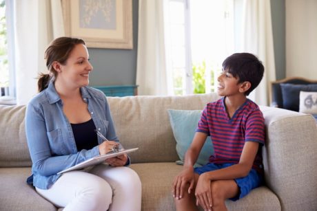 child psychiatrist talking to boy