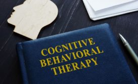 blue book titled cognitive behavioral therapy