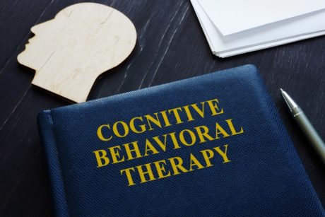 blue book titled cognitive behavioral therapy