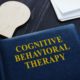 blue book titled cognitive behavioral therapy