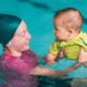 mom baby having swim lessons