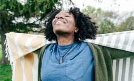 happy woman in blue top