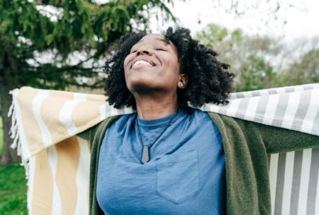 happy woman in blue top