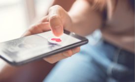 woman using online dating app