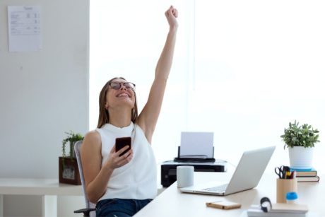 happy woman raising hand