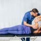 therapist treating female patient joint health