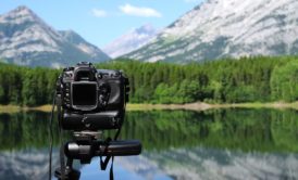 camera and mountain landscape