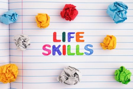 life skills notebook and crumpled colored paper