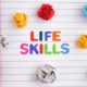 life skills notebook and crumpled colored paper