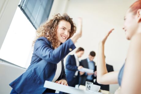 women doing high five