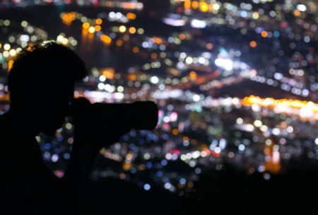 photographer taking pictures at night
