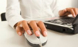 woman holding white mechanical mouse