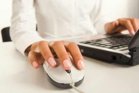 woman holding white mechanical mouse