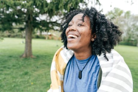 happy woman in blue shirt