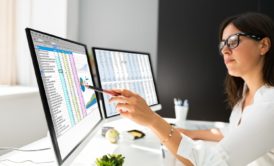 woman working with power BI on desktop computer