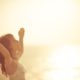 happy woman raising her hands