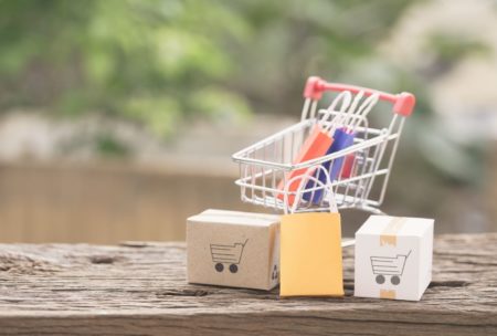 small grocery cart and paper bags