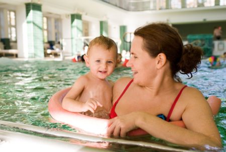 mom and baby in swimming pool
