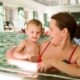 mom and baby in swimming pool