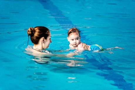 mom swimming with baby