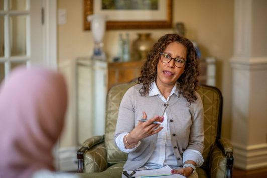 therapist talking to female patient