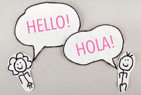 stick figures saying hello and spanish hola