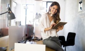 female team manager holding tablet device