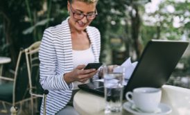 woman in striped jacket being productive