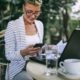 woman in striped jacket being productive