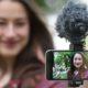 woman recording video of herself with smartphone