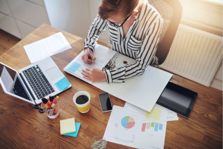 entrepreneur writing on paper