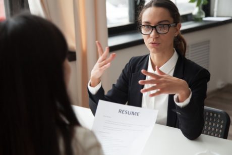 female applicant talking to recruiter in an interview