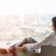 woman relaxing on lounge chair looking at view of the city