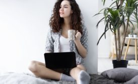 female freelancer with black laptop