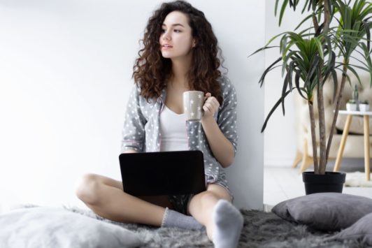 female freelancer with black laptop