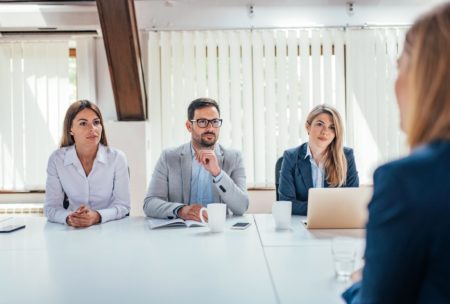 three recruiters interviewing a female job applicant