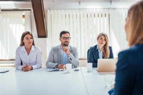 three recruiters interviewing a female job applicant