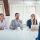 three recruiters interviewing a female job applicant