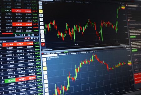 graphs showing the rise and fall of stock trading