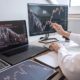 man tracking iq stock options using desktop and laptop computers