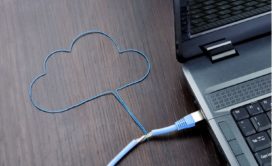 blue cord shaped like a cloud connected to silver laptop