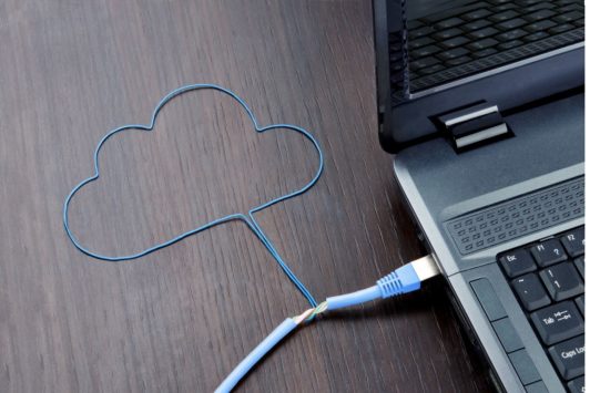 blue cord shaped like a cloud connected to silver laptop